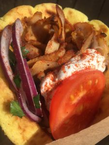 Pork or chicken gyros, tomatoes, onions and tzatziki