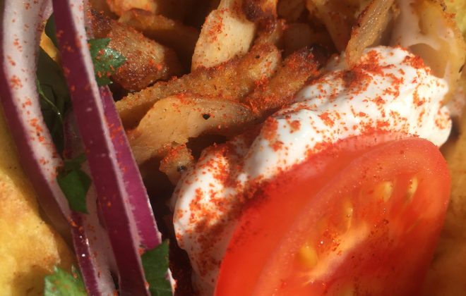 Pork or chicken gyros, tomatoes, onions and tzatziki