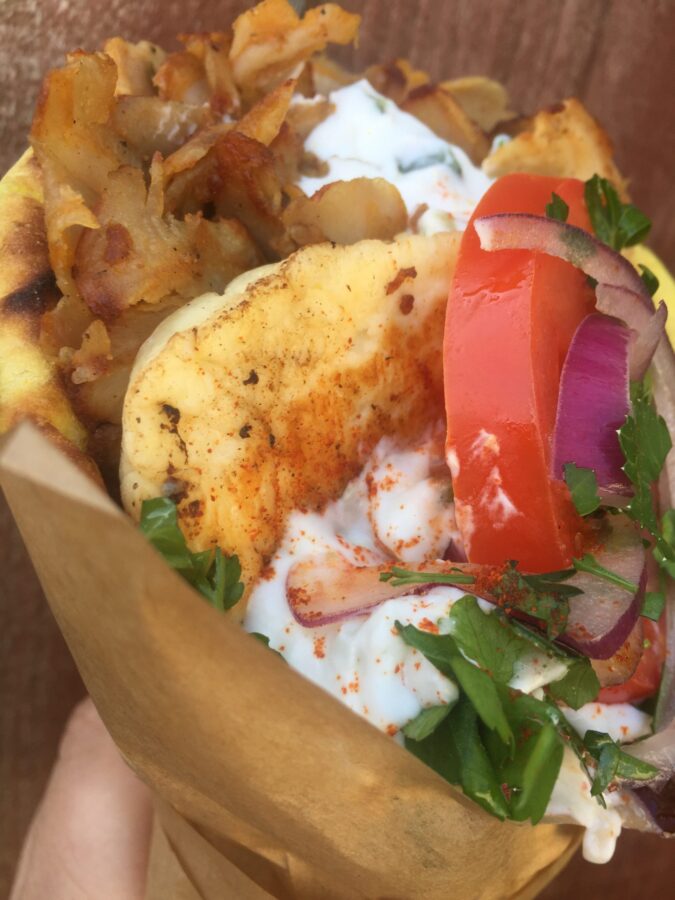 Pork or chicken gyros with halloumi, onions, tomatoes and tzatzii